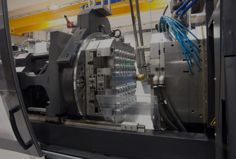 Injection molding machine close up hero